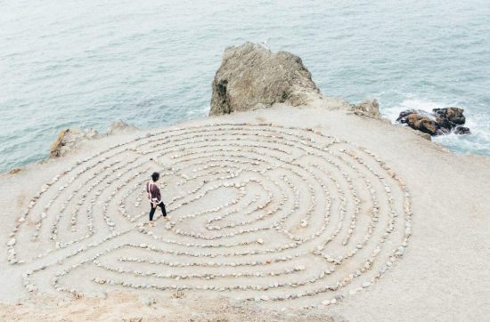 woman walking around maze