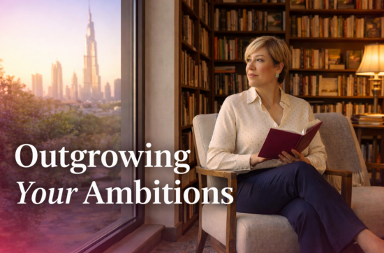Sahar Huneidi Palmer in a quiet library setting, reflecting on self-growth, identity and outgrowing ambitions, with the Dubai skyline in the background.