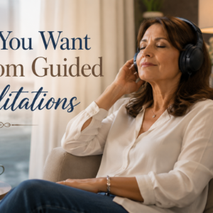 Executive listening to a personalised guided meditation through headphones in a modern office, taking time to relax, improve focus and reconnect with self-awareness.