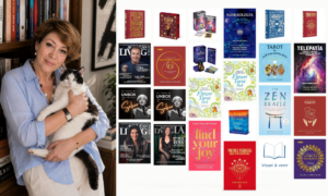 Intuitive Life Mentor, Sahar Huneidi Palmer standing holding her black and white cat by her book case, displaying new books that have been translated into Spanish